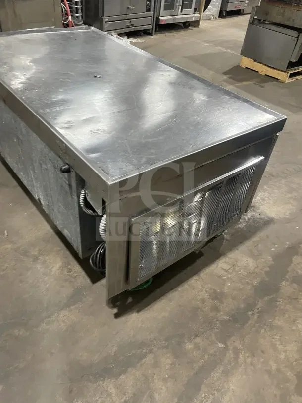 Commercial stainless steel chef base with single door, two drawers, and casters; used condition, refrigerated/freezing.