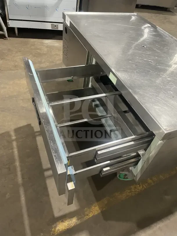 Commercial stainless steel chef base with single door, 2 drawers, refrigerated/freezing function, on casters; used.