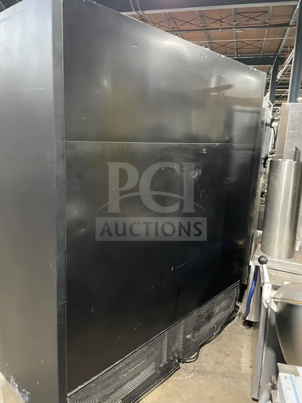 Commercial open-air merchandiser refrigerator with multi-deck display case, black exterior, used condition, visible wear.