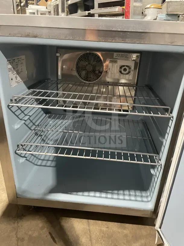 Delfield Enodis 406CA-DD1 Stainless Steel Undercounter Refrigerator, single door, 27", poly-coated rack, on casters.