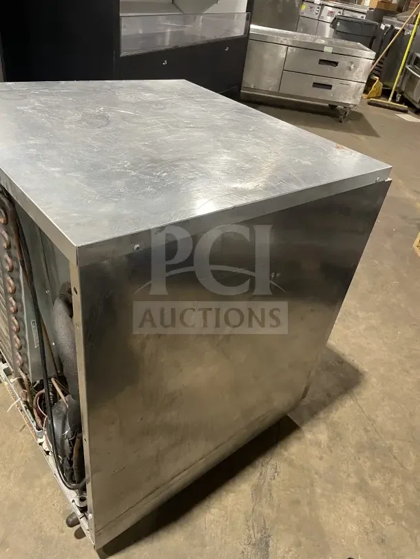 Delfield Enodis Series 27" undercounter refrigerator, stainless steel, model 406CA DD1, with poly-coated rack, on casters.