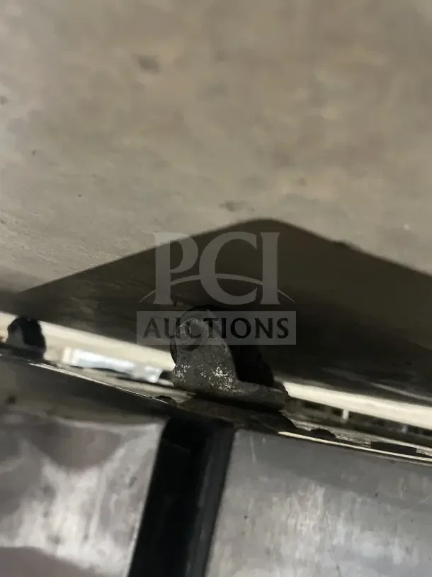 True TUC27LP stainless steel single door lowboy cooler, model TUC27LP, showing caster wheel detail.
