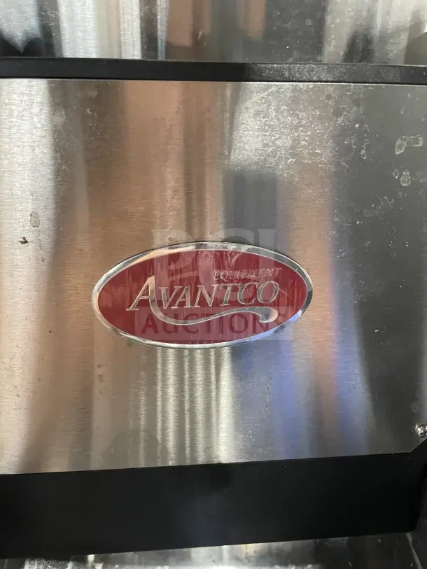 Avantco stainless steel electric lettuce spinner with visible brand logo, showing moderate wear, stainless finish.