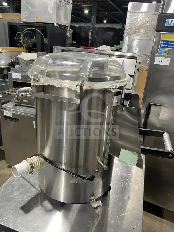 Avantco commercial stainless steel electric lettuce spinner, used condition, with clear lid and drainage hose visible.