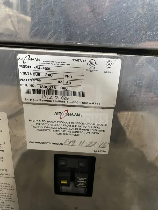 Alto-Shaam HSM-48/5S heated food merchandiser label showing model, voltage, and serial number details.