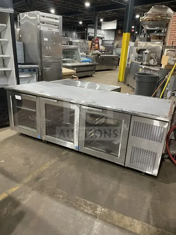 Commercial stainless steel 3 glass door bench fridge, model RF CSY0702, on casters, in used condition.