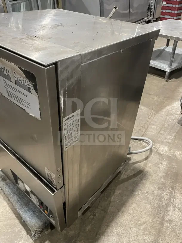 Jackson JP24b stainless steel undercounter dishwasher with poly dish rack. Model JP24b JP24BF, 230V, 1 Phase. Serial: 99F15194M. Visible usage marks.