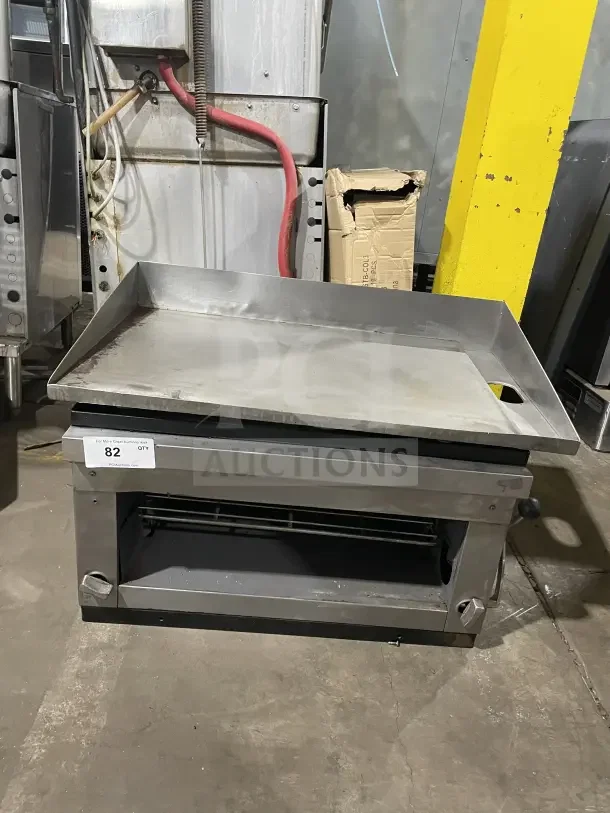 Cecilware stainless steel countertop gas griddle and cheese melter. Features overfire broiler, robust design, fair condition.