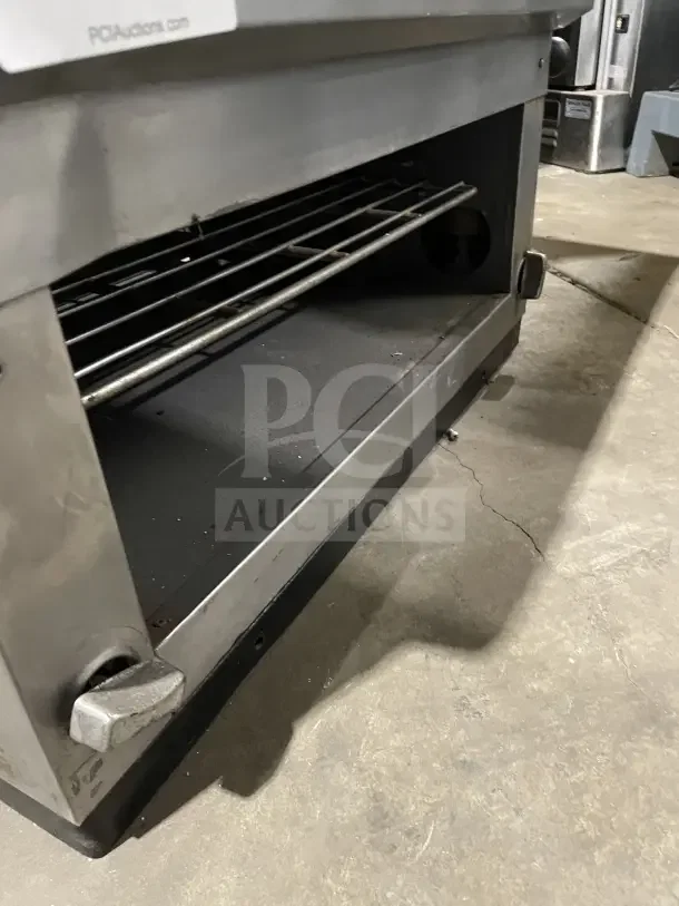 Cecilware stainless steel combination countertop gas griddle and cheese melter in good condition, featuring adjustable rack and sturdy knobs.