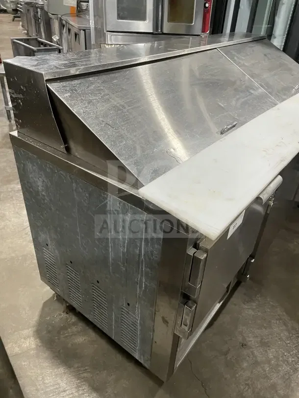 Leader LM72 refrigerated bain marie prep table, three doors, stainless steel, poly-coated wire rack, on casters, used.