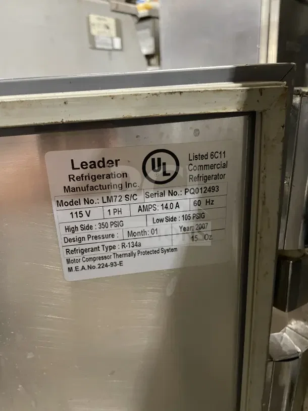 Leader LM72 refrigerated prep table, 2007 model. Stainless steel, 3 doors, bain marie top, on casters. Serial: PQ012493.