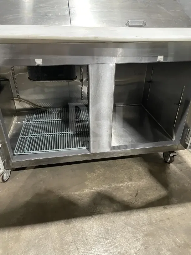 Leader LM72 commercial stainless steel 3-door refrigerated prep table with poly-coated wire rack, casters, and bain marie style top.