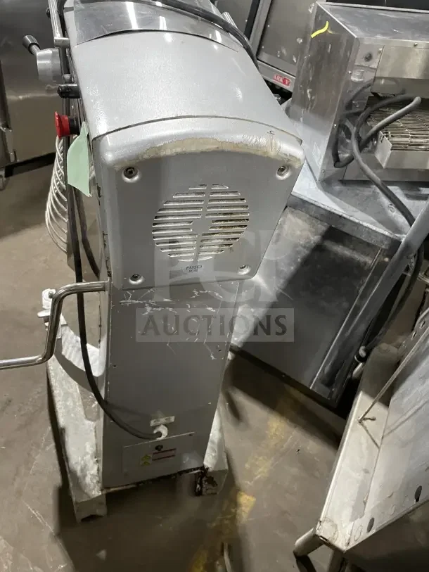 Omcan Commercial 30-Quart Planetary Floor Mixer with visible wear. Features metal body, control panel, and power cord.