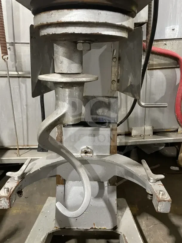 Omcan Commercial 30-quart planetary floor mixer with spiral hook, showing signs of wear. Ideal for heavy-duty use.