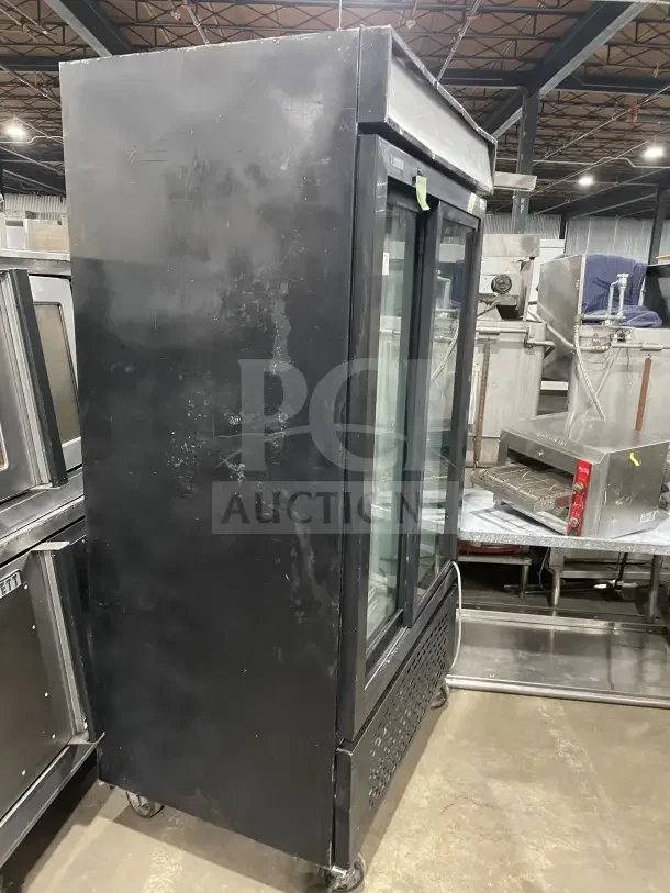 Frigoglass MC1100S-1 commercial black double glass sliding door refrigerator on casters, poly coated wire rack, 120V 1 phase.
