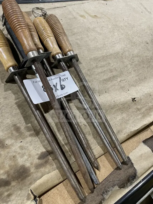 Six kitchen knife honing steels with ribbed wood and composite handles, used condition, labeled "8X6 QTY".