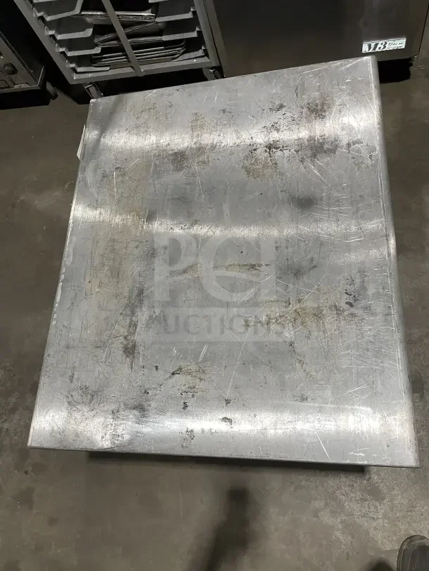 L&J Commercial Stainless Steel 2 Compartment Equipment Stand on legs, shows surface wear and scratches.