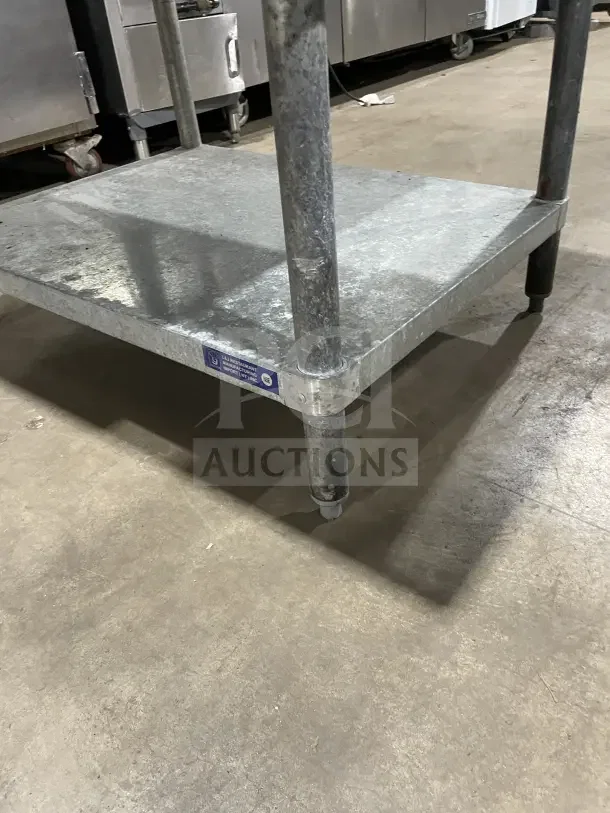 L&J stainless steel 2-compartment equipment stand on legs, durable condition, commercial-grade, visible manufacturer label.