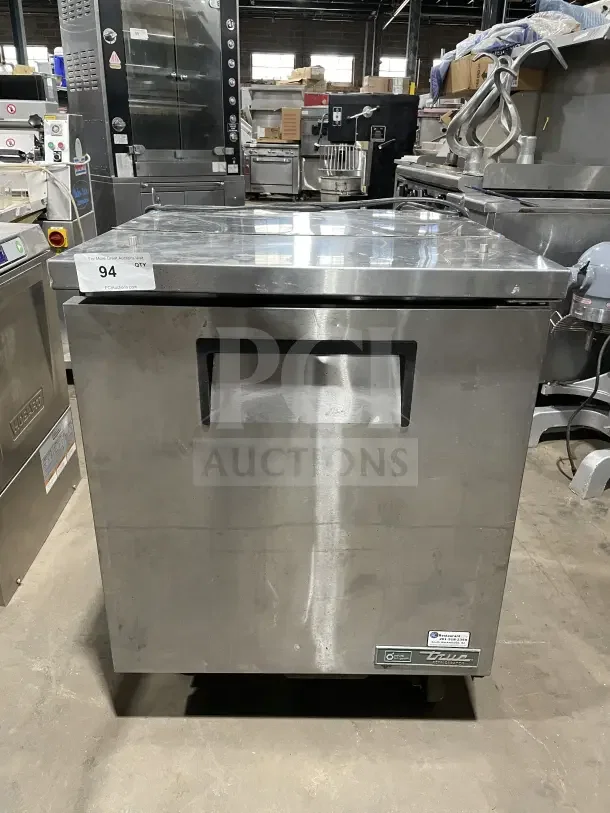 True commercial stainless steel salad/sandwich prep table, model TSSU-27-08-HC, on casters, with poly-coated wire rack.