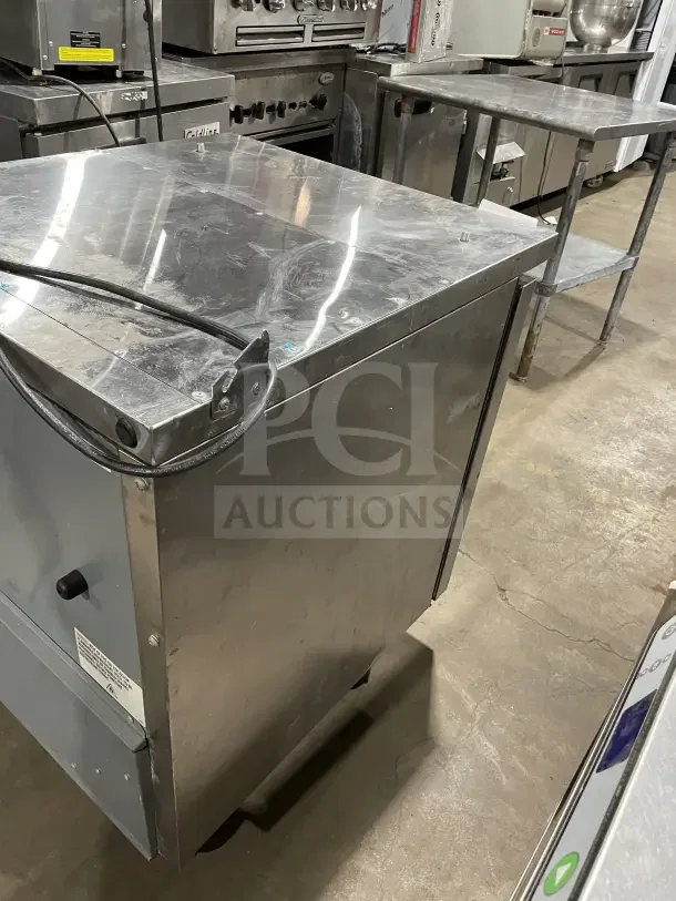 True TSSU-27-08-HC stainless steel refrigerated prep table, single door, on casters, includes poly coated wire rack, 115V.