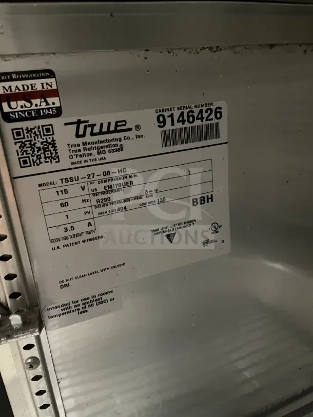 True stainless steel single door prep table, model TSSU-27-08-HC, with poly coated wire rack, serial 9146426, on casters.