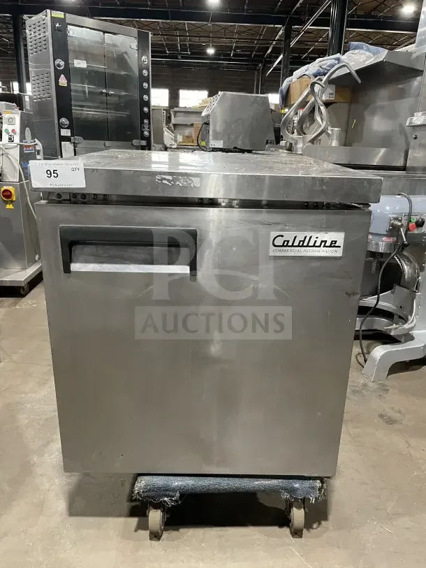 Coldline UUC27RHC stainless steel undercounter refrigerator, 27", with poly coated wire rack, good condition, serial 9125010091.