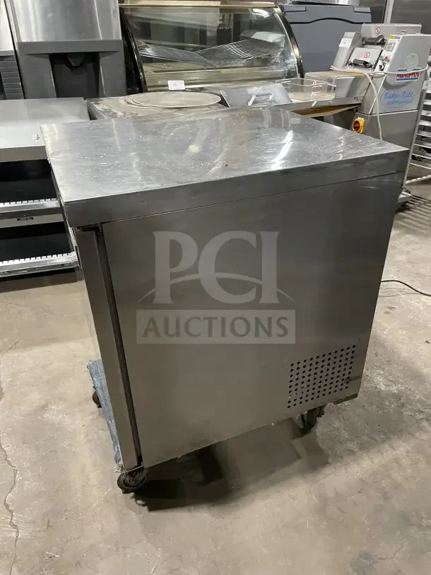 Coldline 27" stainless steel undercounter refrigerator, model UUC-27R-HC. Features poly coated wire rack. Slight surface wear.