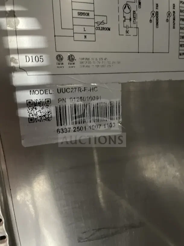 Coldline UUC27RHC stainless steel undercounter refrigerator label showing model UUC27RHC and SN 9125010091 details.