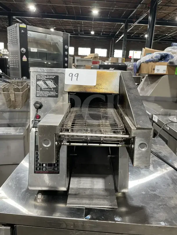 Hatco ITQ-875-1C stainless steel conveyor toaster, model ITQ8751C, SN: 4823167902, with controls and cleaning instructions visible.