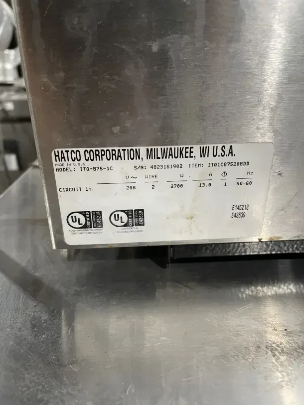 Hatco commercial stainless steel conveyor toaster, model ITQ8751C, used, with visible label showing specs and serial number.