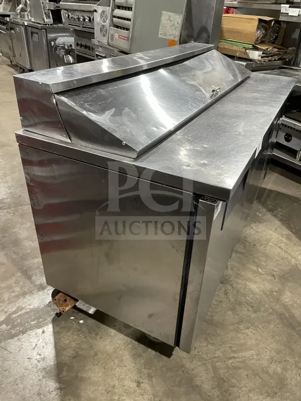 True SSU-72-08 S stainless steel 3-door refrigerated prep table, 72" wide, serial 9463644, in used condition.