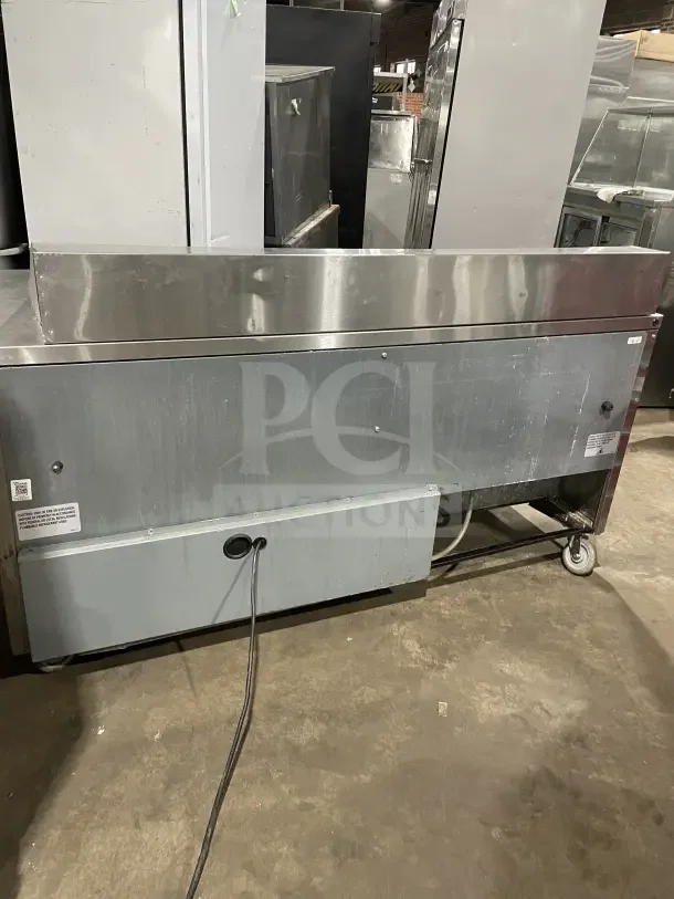 True SSU-72-08 S stainless steel 3-door refrigerated prep table, 72", commercial use, serial 9463644, 115V, 1 phase, on wheels.