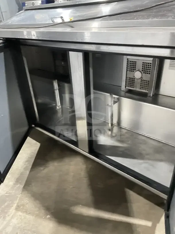 True SSU-72-08 S three-door stainless steel refrigerated prep table, excellent condition, 72-inch, 115V, 1 Phase.