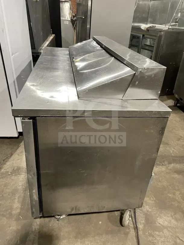 True Commercial Stainless Steel 3-Door Salad Prep Table, Model SSU-72-08 S, 72", on wheels, used condition.