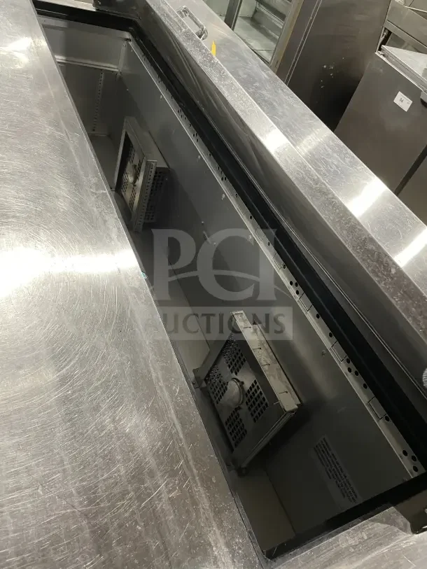 True SSU-72-08 S 3-Door Stainless Steel Prep Table, 72", commercial-grade, 115V, interior view, used condition.