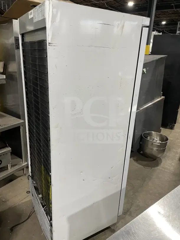 Galaxy 177GRI20RW commercial white reach-in refrigerator, single solid door, on casters, with poly-coated wire rack. Visible wear.