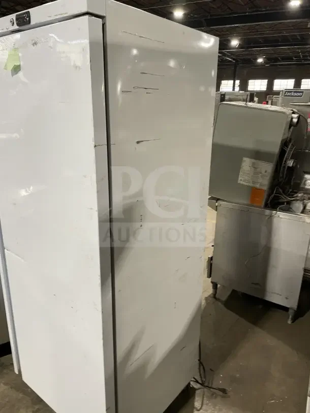 Galaxy commercial white single solid door refrigerator, model 177GRI20RW, on casters, with poly coated wire rack. Visible wear.