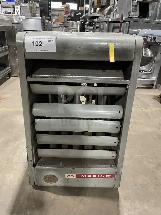 Modine PA Series stainless steel gas-fired industrial unit heater, commercial use, visible wear, auction tag "102".