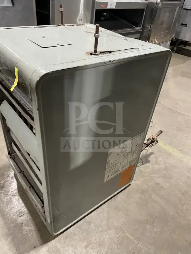 Modine PA Series stainless steel gas-fired unit heater, industrial model. Visible labels, moderate wear, suitable for commercial spaces.