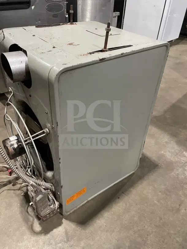 Modine PA Series stainless steel gas-fired industrial unit heater, visible wear, label with specifications, sturdy build.