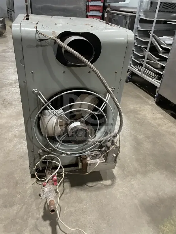 Modine PA Series stainless steel gas-fired unit heater, showing rear view with wiring and vent. Used condition.