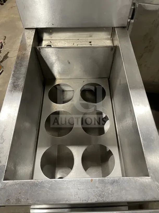 Commercial stainless steel Solstice Supreme pasta cooker with back splash and legs. Features six pasta basket holders. Used condition.