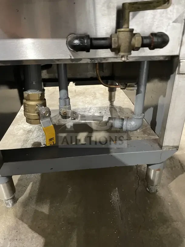 Commercial stainless steel Solstice Supreme pasta cooker with backsplash and legs. Features visible plumbing connections.