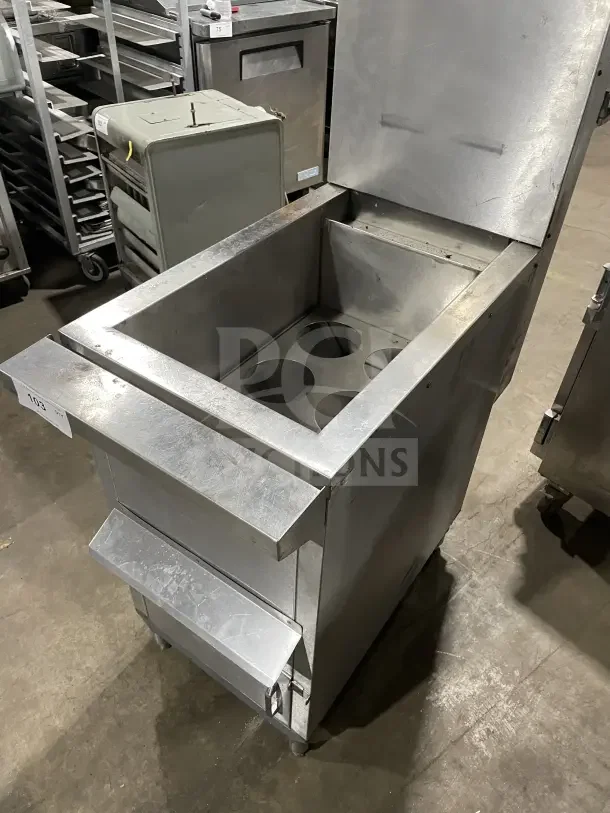Commercial Solstice Supreme stainless steel pasta cooker with back splash, mounted on legs. Features multiple compartments.
