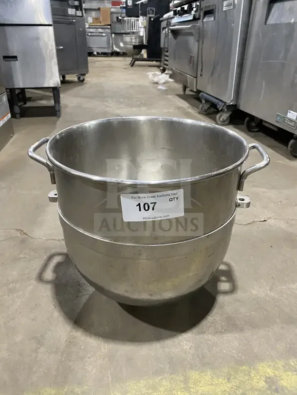 Commercial stainless steel mixing bowl with handles, item 107. Good condition, ideal for professional kitchens.