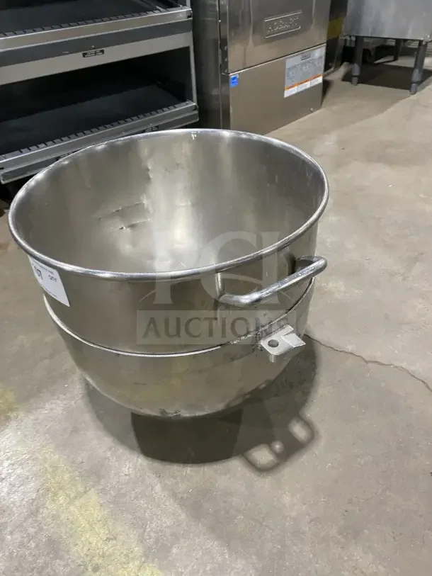 Commercial stainless steel mixing bowl with handles, used condition, durable and ideal for high-volume kitchens.