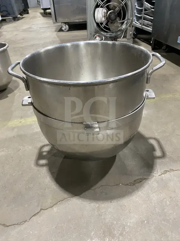 Commercial stainless steel mixing bowl with handles, excellent condition, durable design, ideal for industrial kitchens.