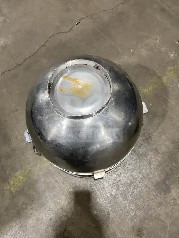 Commercial stainless steel mixing bowl with handles, minor scuffs, sturdy design.