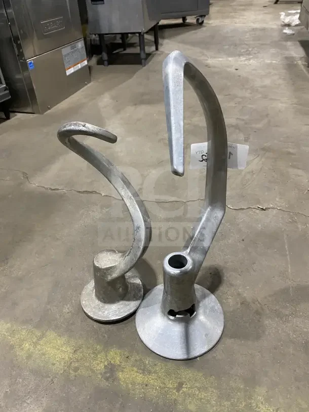 Commercial stainless steel spiral dough hooks, slightly worn, for mixers. Includes two hooks. Tag visible on one hook.