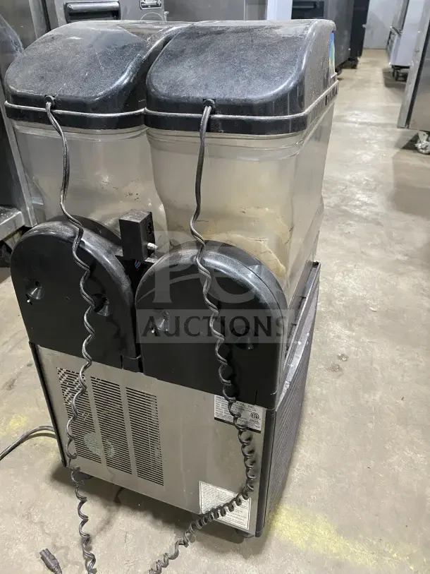 Omega OFS20 countertop slushie dispenser with 2 flavor capacity, Model: OFS20, SN: 2FS16100006, in used condition.